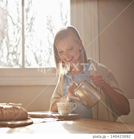Pouring, tea and happy woman in home for morning, calm routine and drink on table. Girl, relax and coffee break with food, snacks or teapot in hands for breakfast preparation on holiday or vacation Pouring, tea and happy woman in home for morning, calm routine and drink on table. Girl, relax and coffee break with food, snacks or teapot in hands for breakfast preparation on holiday or vacation 140423092