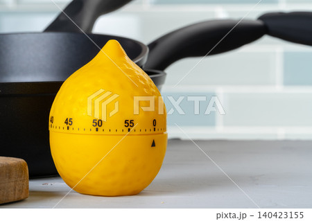 Clean and dry cooking pans on a kitchen counter Clean and dry cooking pans on a kitchen counter 140423155