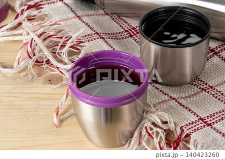 Aluminum metal thermos container bottle close up on table 140423260