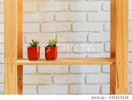 Wooden rack shelf with home decor stuff Wooden rack shelf with home decor stuff 140423326