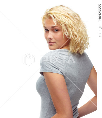 Portrait, fashion and serious with casual woman looking back in studio isolated on white background. Model, hair or confident with shoulder of young person in relaxed clothing outfit for trendy style Portrait, fashion and serious with casual woman looking back in studio isolated on white background. Model, hair or confident with shoulder of young person in relaxed clothing outfit for trendy style 140423355