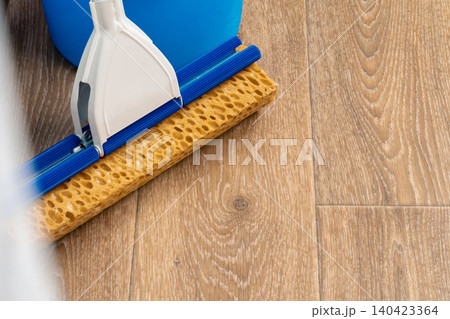 Cleaning tools for house cleaning on wooden floor Cleaning tools for house cleaning on wooden floor 140423364