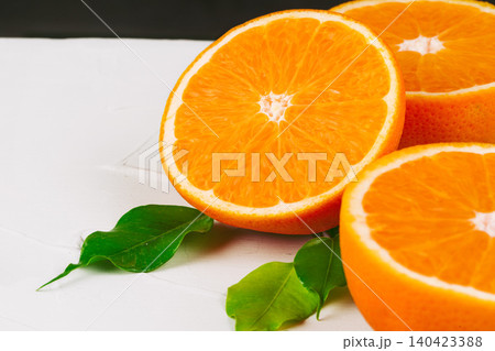 Sliced into pieces juicy ripe oranges close up 140423388
