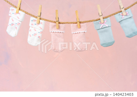 Baby socks on a clothesline. Baby clothes washing Baby socks on a clothesline. Baby clothes washing 140423403