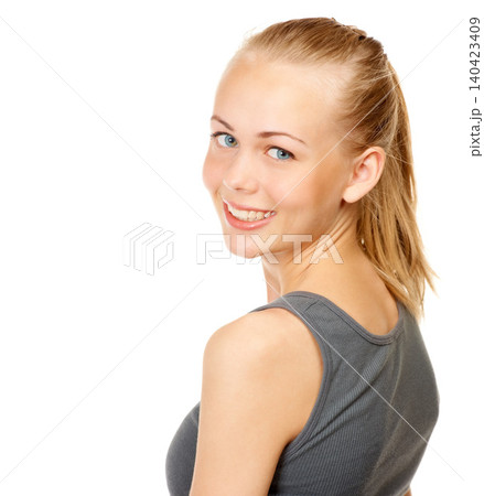 Portrait, exercise and smile with shoulder of woman in studio isolated on white background for workout. Face, health and fitness with happy young athlete looking back for sports or gym training 140423409