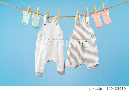 Cute toddler colorful clothing hang on a rope 140423419