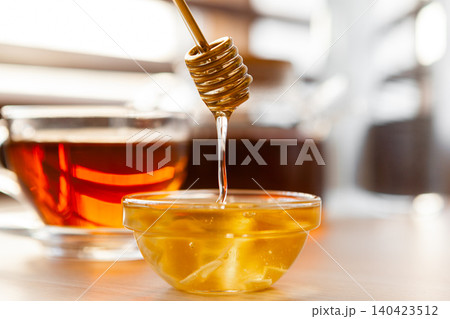 Close up of glass tea cup with honey 140423512