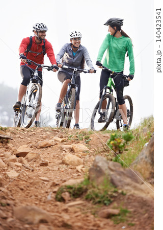 Winter, fitness and people in nature with bicycle for cycling, hobby or morning cardio in park. Bike, riding and group of friends outdoor for travel, workout or biking club, training and wellness 140423541