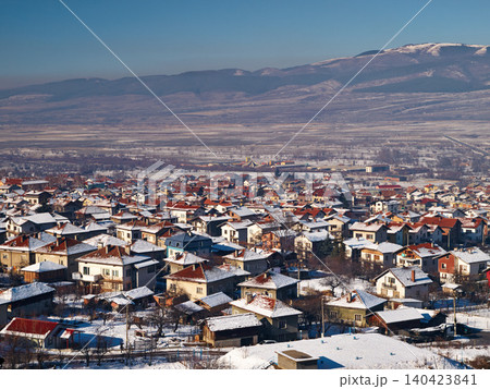 Mountain, village and houses with snow in winter, landscape in Sweden or travel to vacation property. Europe, holiday and ice on real estate homes in town on hill with blue sky and environment 140423841