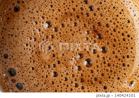 Brown coffee foam with bubles top view Brown coffee foam with bubles top view 140424101