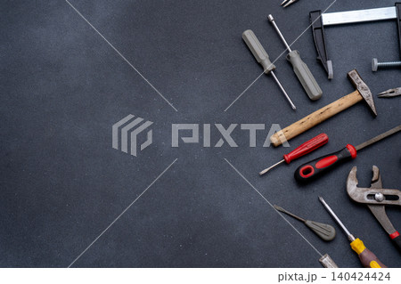 Assortment of Tools Equipment implement on Dark Background Assortment of Tools Equipment implement on Dark Background 140424424