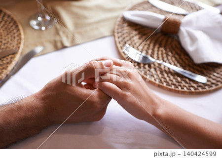 Holding hands, couple and table for support with love in restaurant for care, affection and leisure for bonding. Relationship, trust and together with committed for unity, relax and conversation. Holding hands, couple and table for support with love in restaurant for care, affection and leisure for bonding. Relationship, trust and together with committed for unity, relax and conversation. 140424599