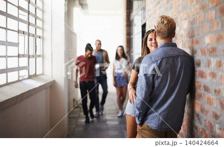 University, people and students in a hallway, conversation and speaking with humor and education. Group, men or women in a lobby with discussion or learning with knowledge or college with scholarship University, people and students in a hallway, conversation and speaking with humor and education. Group, men or women in a lobby with discussion or learning with knowledge or college with scholarship 140424664
