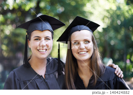 Students, portrait and graduation with women outdoor at university, college and achievement ceremony. Education, campus and class at certificate, degree and school event with a smile from diploma Students, portrait and graduation with women outdoor at university, college and achievement ceremony. Education, campus and class at certificate, degree and school event with a smile from diploma 140424882