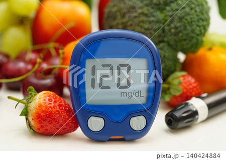 Digital glucose meter with vegetable and fruit. 140424884