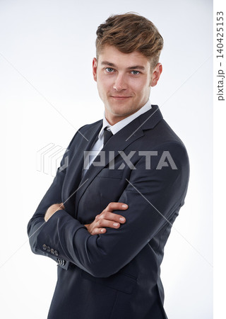 Portrait, confident or man in suit for fashion, style and clothes for business, corporate or formal. Male model, arms crossed and smile for modern, smart and classy office wear on white background Portrait, confident or man in suit for fashion, style and clothes for business, corporate or formal. Male model, arms crossed and smile for modern, smart and classy office wear on white background 140425153