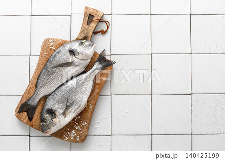 Fresh raw dorado fish cooking with ingredients. Sea bream, dorado. Seafood, healthy food. Top view 140425199