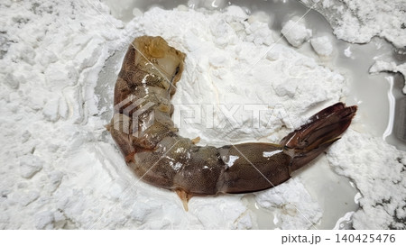 Peeled Raw Prawn Being Dusted with White Flour for Deep Frying Peeled Raw Prawn Being Dusted with White Flour for Deep Frying 140425476