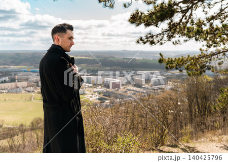 Thoughtful Male Traveler at Scenic Viewpoint 140425796