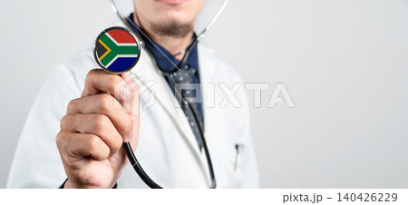South Africa healthcare system, South African national healthcare concept. Hand of doctor holding stethoscope South Africa healthcare system, South African national healthcare concept. Hand of doctor holding stethoscope 140426229