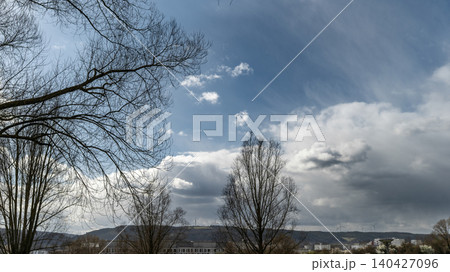 Dramatic Spring Sky Above Bare Trees 140427096