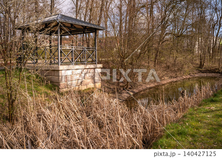 Gazebo Beside Reeds and Stream in Spring Park Gazebo Beside Reeds and Stream in Spring Park 140427125