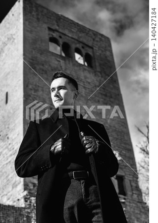 Man In Black Coat At Castle Viewpoint Man In Black Coat At Castle Viewpoint 140427184