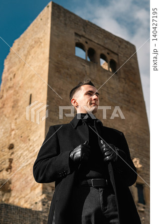 Man In Black Coat At Castle Viewpoint Man In Black Coat At Castle Viewpoint 140427195