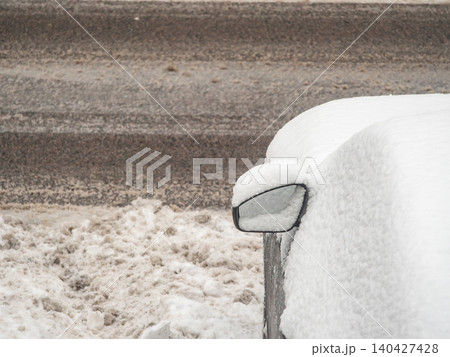 Close up of snow covered car side mirror in winter Close up of snow covered car side mirror in winter 140427428