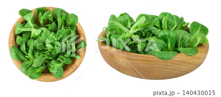Valerian leaves salad. Corn salad in wooden bowl isolated on white backgrounds. Lettuce salad. Top view Valerian leaves salad. Corn salad in wooden bowl isolated on white backgrounds. Lettuce salad. Top view 140430015