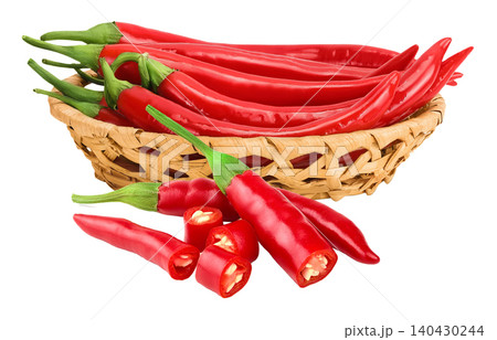 red hot chili pepper in wicker basket isolated on white background. red hot chili pepper in wicker basket isolated on white background. 140430244