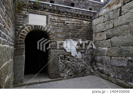 Ancient stone entrance and weathered fortress walls of the Great Wall of China Ancient stone entrance and weathered fortress walls of the Great Wall of China 140430806