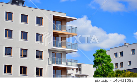 European residential architecture harmonizing with nature. Eco-friendly living in city with greens. Eco apartment building saving energy and fresh air concept. European residential architecture harmonizing with nature. Eco-friendly living in city with greens. Eco apartment building saving energy and fresh air concept. 140431085