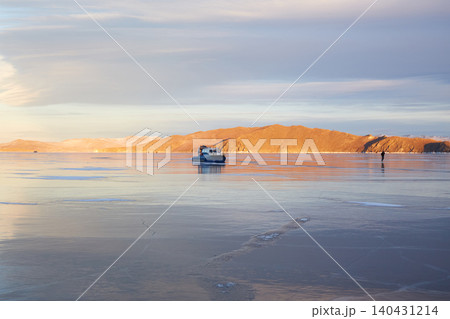A hovercraft on the transparent ice of the frozen Lake Baikal. A hovercraft on the transparent ice of the frozen Lake Baikal. 140431214