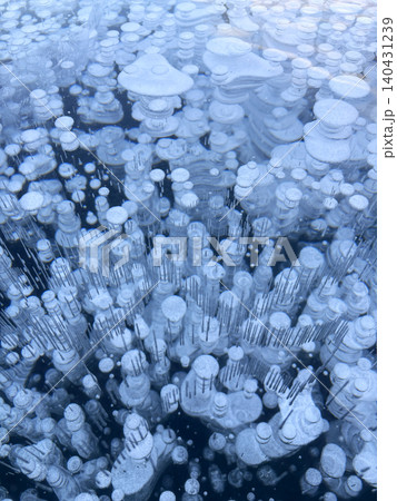 Ice bubbles create a stunning pattern on frozen Lake Baikal. Ice bubbles create a stunning pattern on frozen Lake Baikal. 140431239