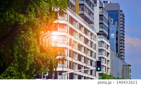 View of modern residential building with glass balconies and bright facade. Contemporary apartment building in european city. Concept of urban living and modern architecture. View of modern residential building with glass balconies and bright facade. Contemporary apartment building in european city. Concept of urban living and modern architecture. 140431621