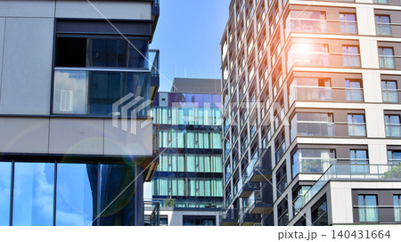 View of modern residential building with glass balconies and bright facade. Contemporary apartment building in european city. Concept of urban living and modern architecture.  140431664