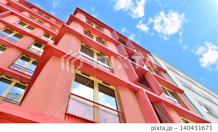 View of modern residential building with glass balconies and bright facade. Contemporary apartment building in european city. Concept of urban living and modern architecture.  140431671