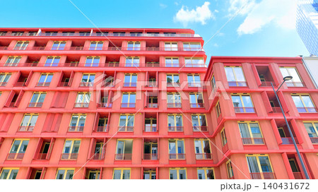 View of modern residential building with glass balconies and bright facade. Contemporary apartment building in european city. Concept of urban living and modern architecture.  140431672