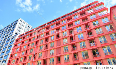 View of modern residential building with glass balconies and bright facade. Contemporary apartment building in european city. Concept of urban living and modern architecture.  140431673