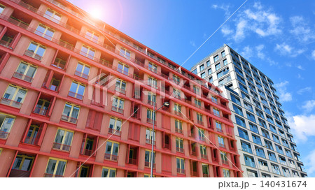 View of modern residential building with glass balconies and bright facade. Contemporary apartment building in european city. Concept of urban living and modern architecture.  140431674