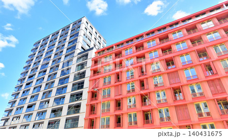 View of modern residential building with glass balconies and bright facade. Contemporary apartment building in european city. Concept of urban living and modern architecture. View of modern residential building with glass balconies and bright facade. Contemporary apartment building in european city. Concept of urban living and modern architecture. 140431675