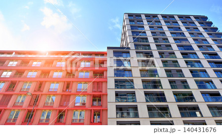 View of modern residential building with glass balconies and bright facade. Contemporary apartment building in european city. Concept of urban living and modern architecture.  140431676