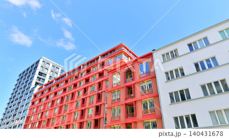 View of modern residential building with glass balconies and bright facade. Contemporary apartment building in european city. Concept of urban living and modern architecture. View of modern residential building with glass balconies and bright facade. Contemporary apartment building in european city. Concept of urban living and modern architecture. 140431678