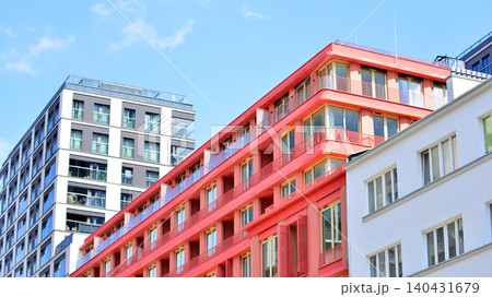 View of modern residential building with glass balconies and bright facade. Contemporary apartment building in european city. Concept of urban living and modern architecture.  140431679