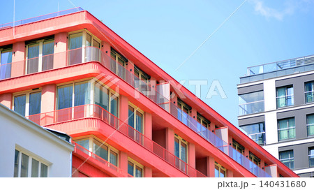 View of modern residential building with glass balconies and bright facade. Contemporary apartment building in european city. Concept of urban living and modern architecture.  140431680