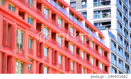 View of modern residential building with glass balconies and bright facade. Contemporary apartment building in european city. Concept of urban living and modern architecture. View of modern residential building with glass balconies and bright facade. Contemporary apartment building in european city. Concept of urban living and modern architecture. 140431682