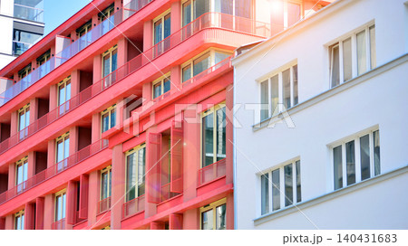 View of modern residential building with glass balconies and bright facade. Contemporary apartment building in european city. Concept of urban living and modern architecture.  140431683