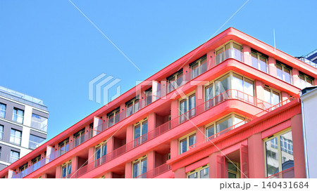 View of modern residential building with glass balconies and bright facade. Contemporary apartment building in european city. Concept of urban living and modern architecture. View of modern residential building with glass balconies and bright facade. Contemporary apartment building in european city. Concept of urban living and modern architecture. 140431684