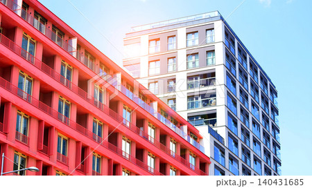 View of modern residential building with glass balconies and bright facade. Contemporary apartment building in european city. Concept of urban living and modern architecture.  140431685